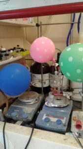 Happier times in the lab: Balloons and lab equipment.