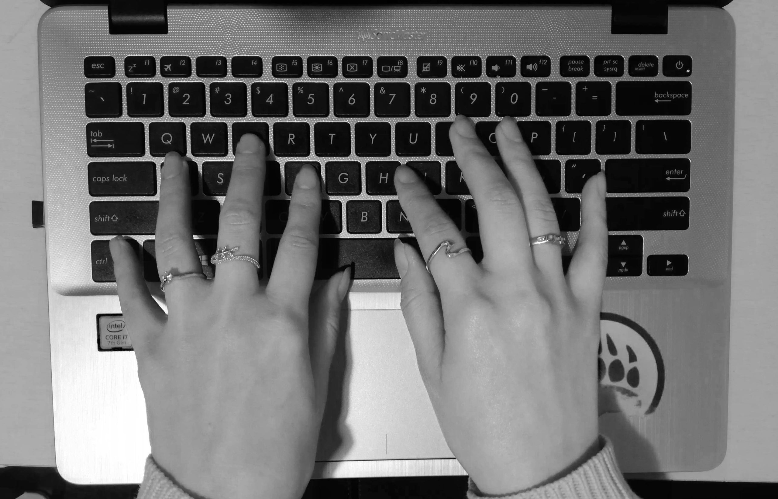 Picture of hands on a keyboard, editing a novel.