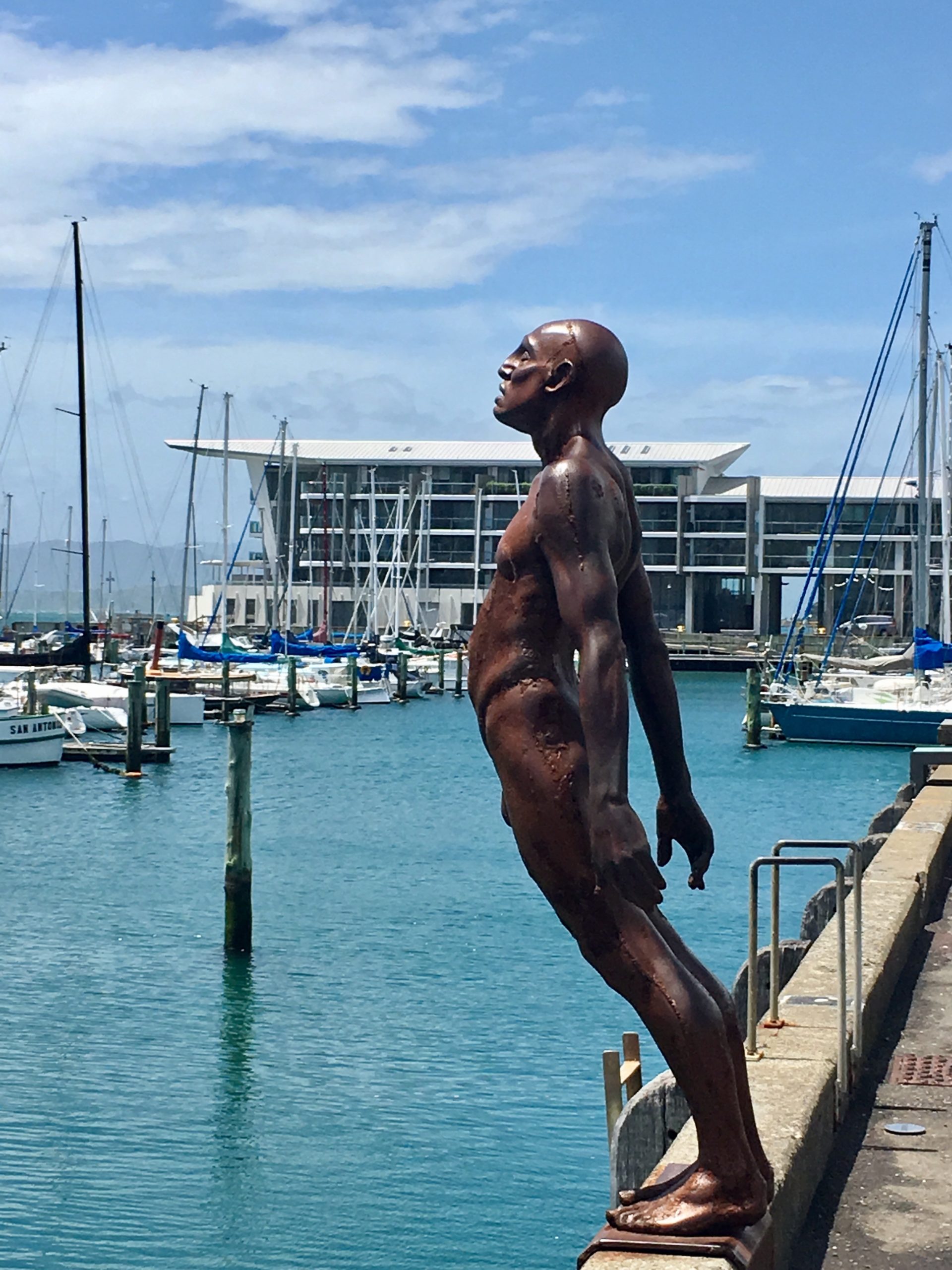 Sometimes fighting covid-19 feels a bit like this statue in Wellington Harbour: leaning into the wind and hoping you're not going to fall. Getting vaccinated is our only safety net right now.