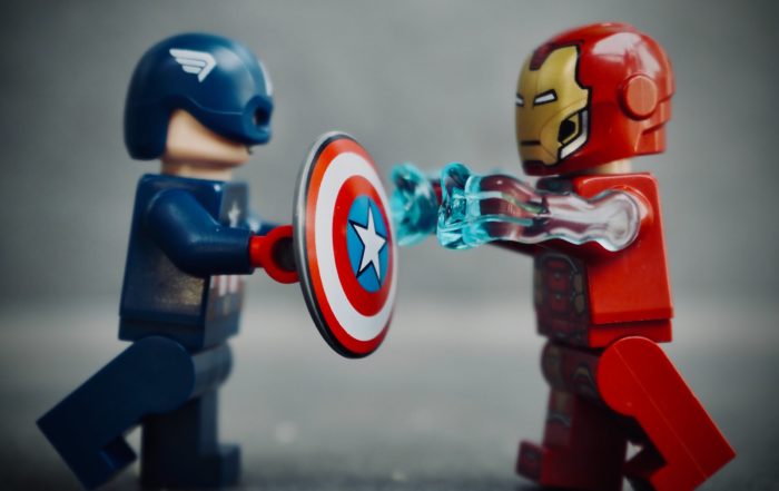 A constant question to new Indie Publishers is whether they should use IngramSpark or Amazon KDP for publishing. Two lego men are locked in battle in this photo depicting the two companies.